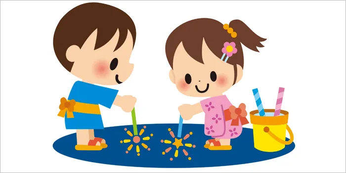 花火をしている男の子と女の子のイラスト