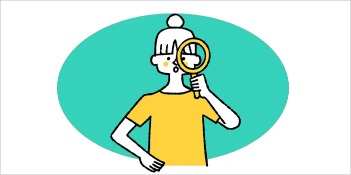 虫眼鏡を持つ女性