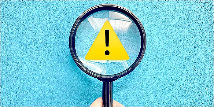 注意マークと虫眼鏡